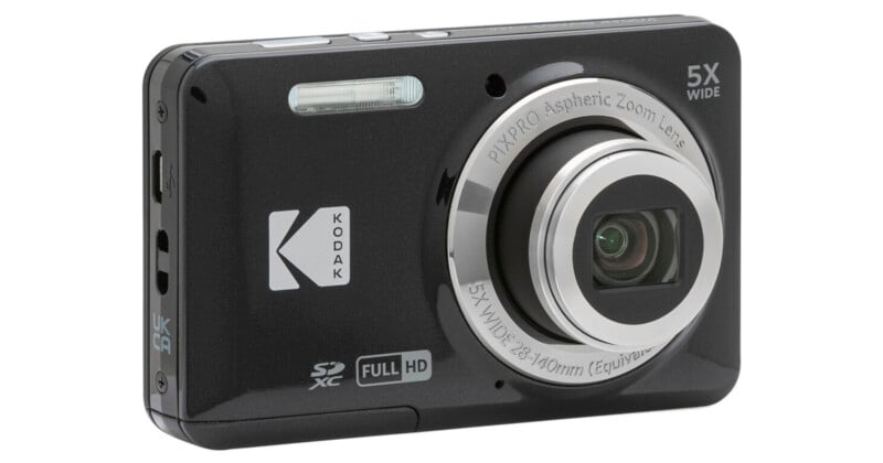 A black Kodak digital camera with a 5X wide zoom lens, full HD capability, and SD card slot. The lens and flash are visible on the front, along with branding and feature labels.