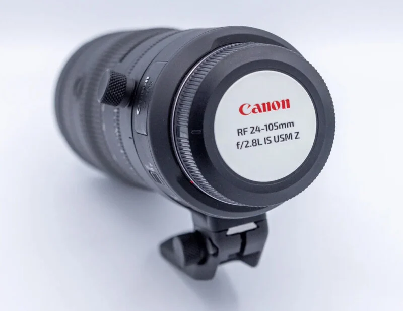 A Canon RF 24-105mm f/2.8L IS USM Z lens with a tripod mount ring, shown from the rear angle against a white background.