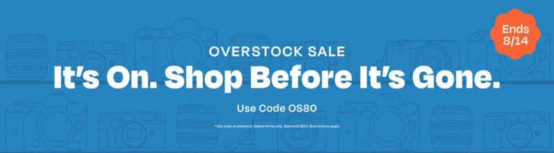 A blue promotional banner featuring camera and lens line art, with the text "OVERSTOCK SALE", "It's On. Shop Before It's Gone.", "Use Code OS80", and an orange "Ends 8/14" badge.