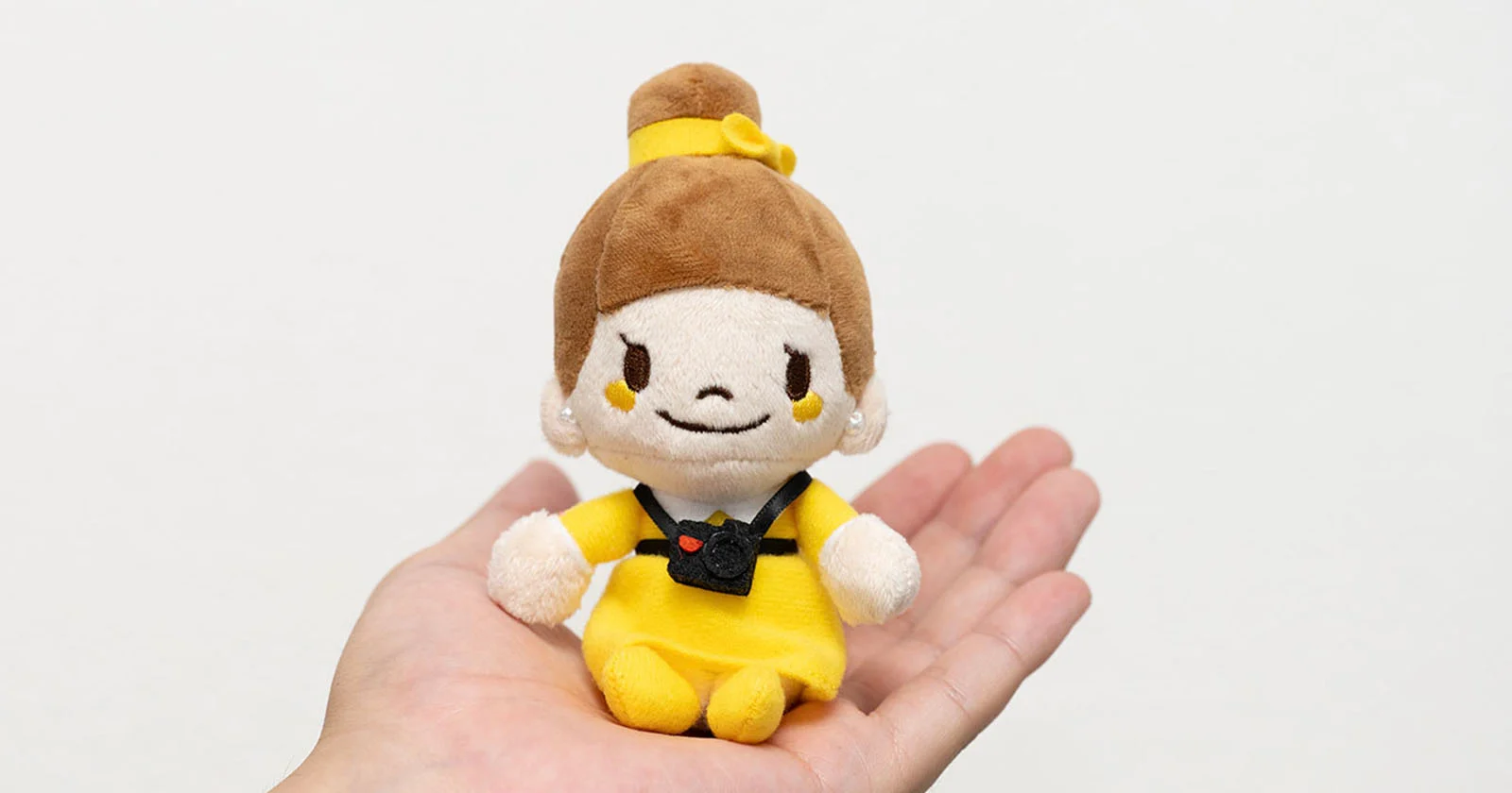 Nikon verkoopt een schattige pluche-sleutelhanger van de mascotte van Nikon