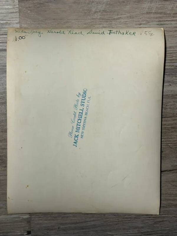 The back of a photograph with handwritten names "Rita Lacy, Harold Read, David Toothaker" and a stamp for Jack Mitchell Studio.