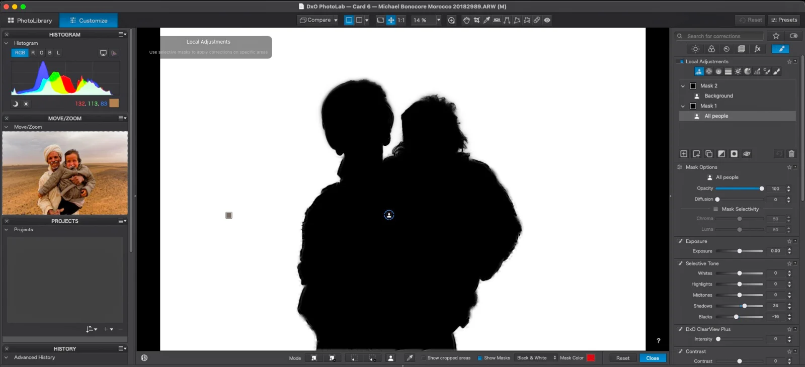 A screenshot of the DxO PhotoLab software interface showing a silhouette mask applied to two people, with the original image visible in the Move/Zoom panel.