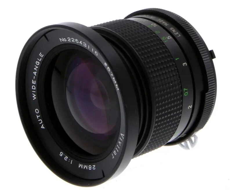 A Vivitar 28mm f/2.5 wide-angle camera lens with a 67mm filter thread, shown from a front-angled perspective.