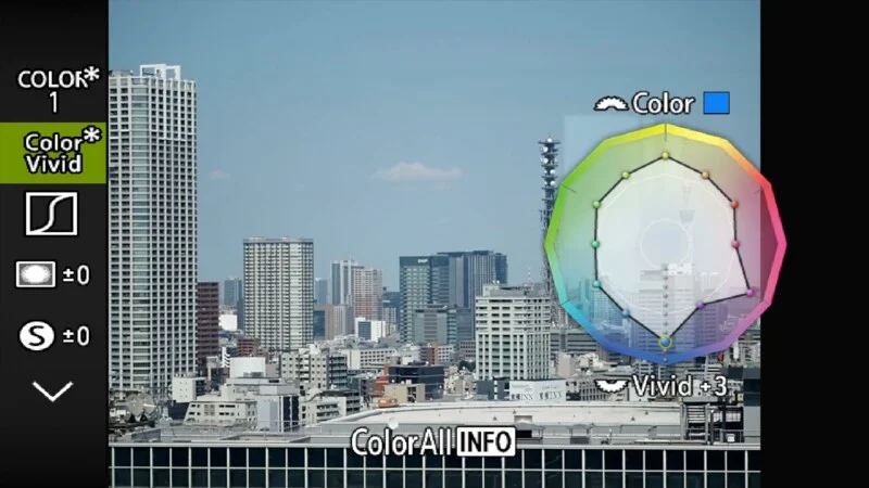 A digital camera menu overlay displays color settings over a cityscape, featuring a color adjustment wheel with a
