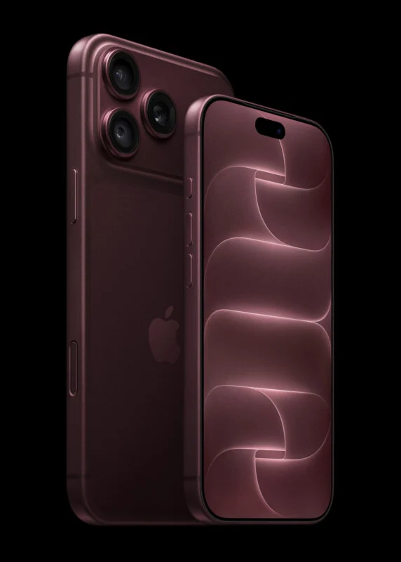 Two smartphones in a deep burgundy color are positioned against a black background, with one showing its back camera array and the other displaying a matching abstract wallpaper on its screen.