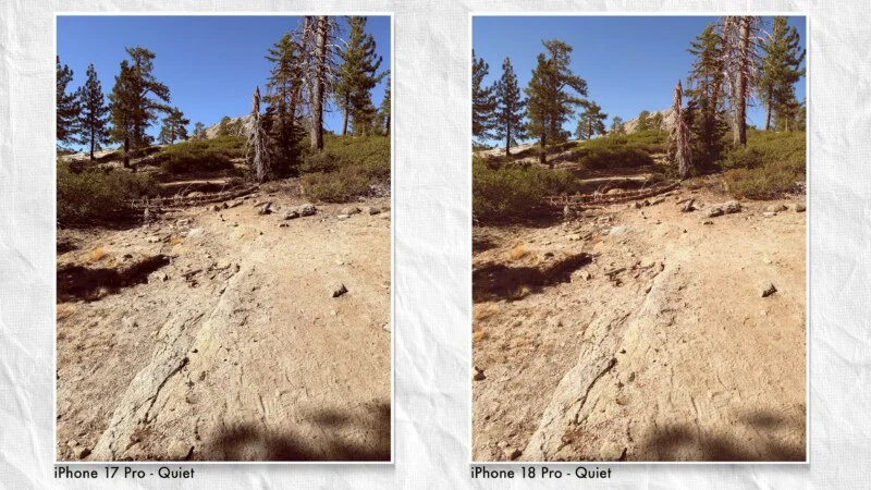 Twee side-by-side foto's van een dirt trail die een helling omhoog loopt richting pijnbomen onder een heldere blauwe lucht, gelabeld „iPhone 17 Pro - Quiet” en „iPhone 18 Pro - Quiet.”