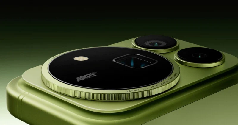 A close-up of a light green smartphone camera module featuring a large circular lens housing with the text "ARRI" and technical specifications printed on the rim, alongside two smaller circular lenses.