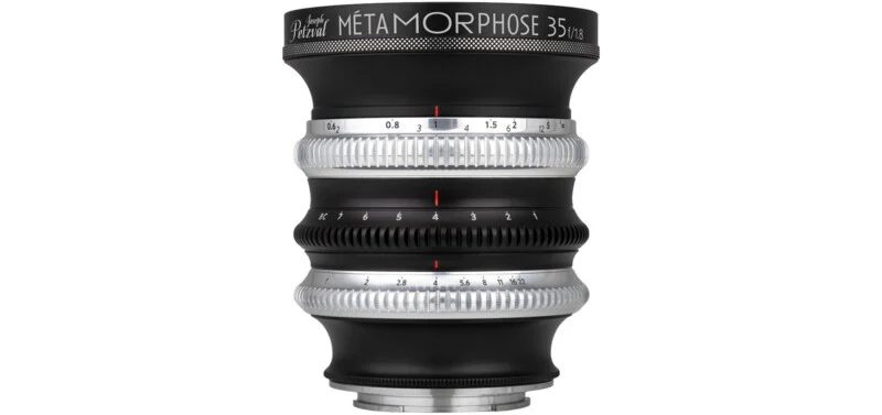 A black Joseph Petzval Métamorphose 35 f/1.8 camera lens with three silver and black adjustment rings against a white background.