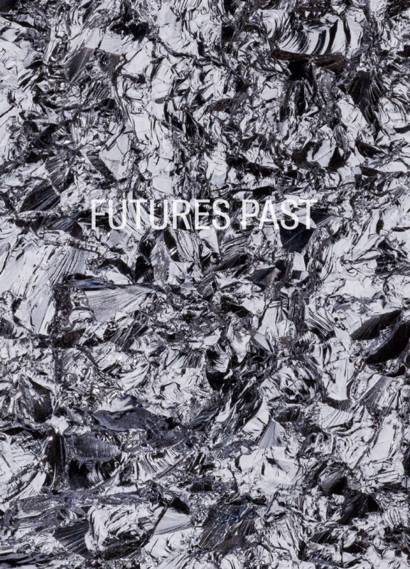 The words "FUTURES PAST" are centered in white, sans-serif text over a background of jagged, reflective black and silver shards.