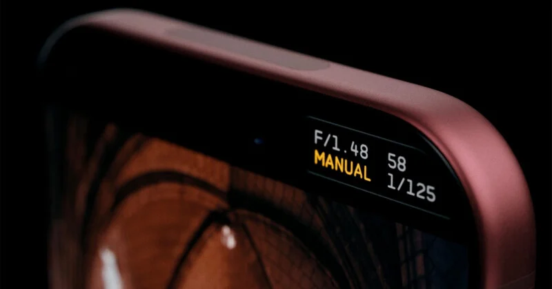 A close-up of a smartphone screen displaying camera settings including "F/1.48", "58", "MANUAL", and "1/125" in the corner.